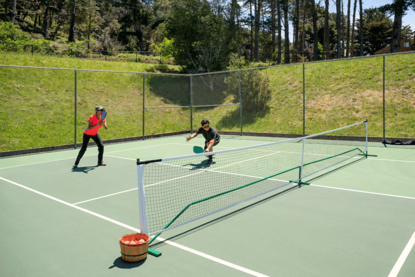 Two pickleball players in the 2-3 Zone Defense position