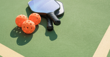 Guide on buying a pickleball paddle, showing various paddle options and features to consider