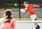 Pickleball player executing a successful volley at the net